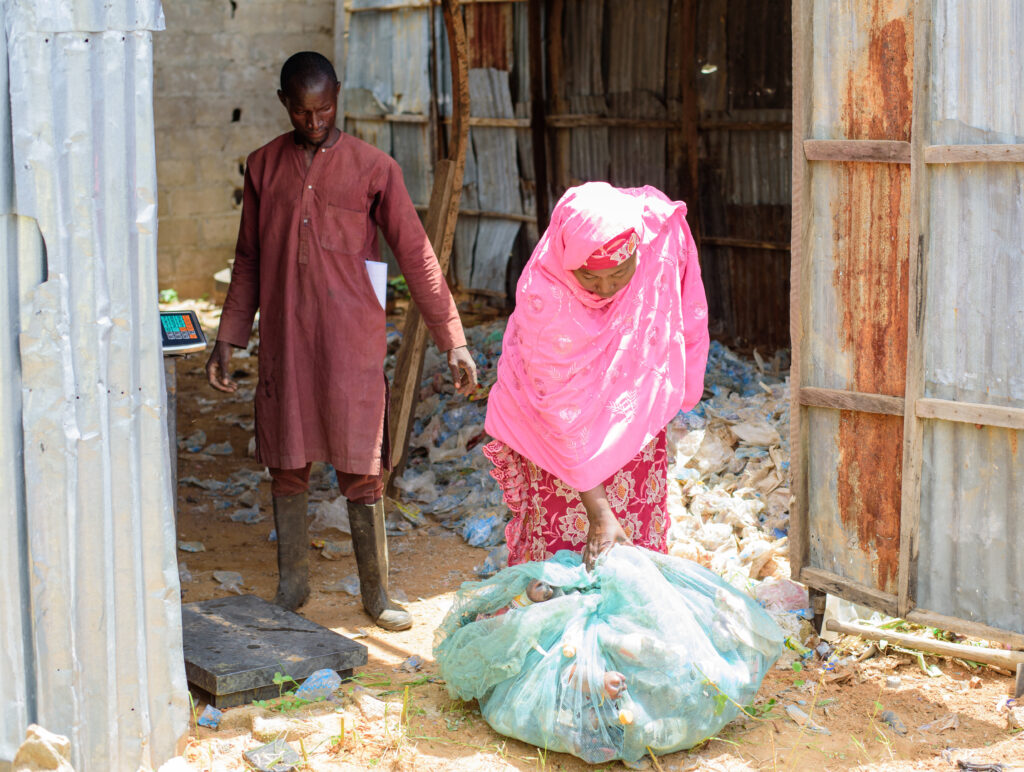 On August 21, we met with Muhammad Abdullahi co funder of Trash 4 Health in Azare, Bauchi.

In this photo, Umar Dada is exchanging waste plastics to Trash 4 Health initiative for medical supplies. She is diabetic, and this exchange has been her way of managing her sugar levels and accessing the medication she needs.